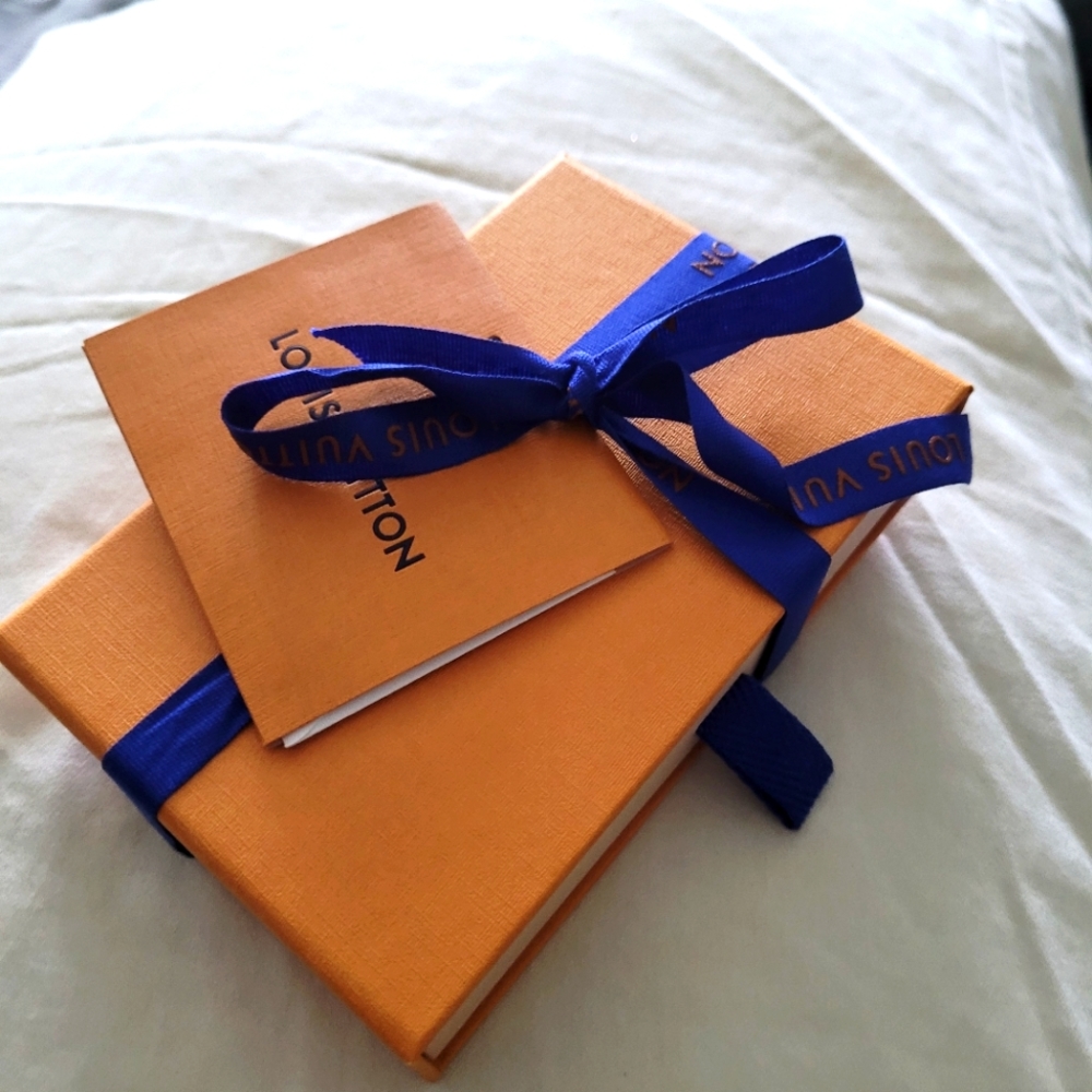 Louis Vuitton box, card, and ribbon